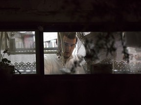 Israeli ZAKA emergency response members are seen in the Israeli settlement of Halamish, Saturday, July 22, 2017. Israel's military has sent more troops to the West Bank and placed forces on high alert a day after a Palestinian stabbed to death three members of an Israeli family and Israeli-Palestinian clashes erupted over tensions at the Holy Land's most contested shrine. (AP Photo/Tsafrir Abayov)