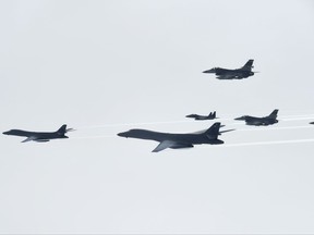 In this photo provided by South Korea Defense Ministry, U.S. Air Force B-1B Lancer bombers, left and second from left, fly with South Korean and U.S. fighter jets over the Korean Peninsula, South Korea Saturday, July 8, 2017. Two U.S. bombers flew to the Korean Peninsula to join fighter jets from South Korea and Japan for a practice bombing run as part of a training mission in response to North Korea's ballistic missile and nuclear programs, officials said Friday. (South Korea Defense Ministry via AP)