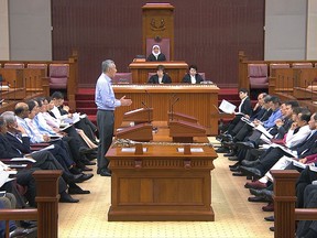 In this image made from video provided by Parliament House of Singapore, Singapore's Prime Minister Lee Hsien Loong delivers a speech in Parliament Monday, July 3, 2017, in Singapore.  Prime Minister Lee has addressed his escalating family feud in a speech in Parliament, saying his siblings' accusations that he had misused government power were "entirely baseless." (Parliament House of Singapore via AP)