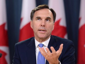 Minister of Finance Bill Morneau holds a press conference at the National Press Theatre in Ottawa on Tuesday, July 18, 2017. THE CANADIAN PRESS/Sean Kilpatrick