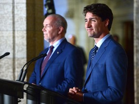Prime Minister Justin Trudeau holds a press conference with Premier of British Columbia John Horgan following their meeting on Parliament Hill in Ottawa on Tuesday, July 25, 2017. THE CANADIAN PRESS/Sean Kilpatrick