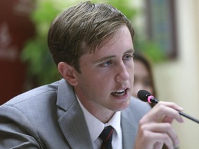 In this Monday, July 17, 2017, photo, American Nathan Bartling, from Chino Hills, Calif., talks to reporters in Bangkok after he apologized for placing coins on a railroad track for a YouTube video. Bartling, who is a YouTube star with 3.29 million subscribers, is in trouble for posting a video of an age-old practice among kids: flattening coins on railroad tracks. (AP Photo)