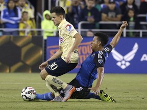 FILE - In this July 14, 2015, file photo,  Jose Earthquakes midfielder Matheus Silva, right, challenges Club America forward Alejandro Diaz (30) for the ball during the second half of an International Champions Cup soccer match in San Jose, Calif. Silva, 20, was swimming in Lake Tahoe on the Fourth of July when he had to be rescued. He received life-saving resuscitation at the scene and then was taken to a nearby hospital before being flown to a hospital in Reno, Nev., where he was in "critical but stable condition" on Tuesday, July 4, 2017. (AP Photo/Jeff Chiu, File)
