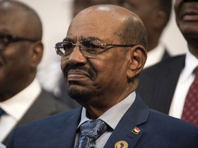 FILE - In this June 14, 2015 file photo, Sudanese President Omar al-Bashir smiles during a visit to Johannesburg, South Africa. In the Hague, Netherlands, Thursday, July 6, 2017 the International Criminal Court has ruled that South Africa should have arrested al-Bashir, who is wanted in connection with war crimes, when he entered the country. (AP Photo/Shiraaz Mohamed, File)