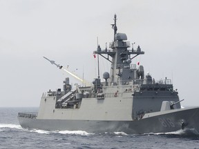 In this photo provided by South Korea Defense Ministry, a South Korean navy ship fires a missile during a drill in South Korea's East Sea, Thursday, July 6, 2017. South Korean warplanes and navy ships have fired a barrage of missiles into the waters during one-day drills aimed at boosting a readiness against a possible North Korean aggression. (South Korea Defense Ministry via AP)