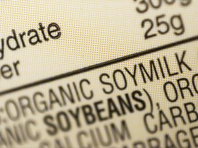 FILE - This Thursday, Feb. 16, 2017, file photo shows the ingredients label for soy milk at a grocery store in New York. The dairy industry says terms like "soy milk" violate the federal standard for milk, but even government agencies have internally clashed over the proper term. (AP Photo/Patrick Sison, File)