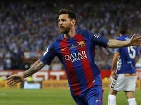 In this  Saturday May 27, 2017 file photo, Barcelona's Lionel Messi celebrates after scoring a goal during the Copa del Rey final soccer match between Barcelona and Alaves at the Vicente Calderon stadium in Madrid, Spain. Barcelona said Wednesday July 5, 2017, Argentina forward Lionel Messi has agreed to extend his contract that will tie him to the Spanish club through June 30, 2021. (AP Photo/Daniel Ochoa de Olza, File)