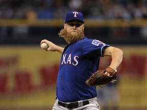 Texas Rangers starter Andrew Cashner pitches against the Tampa Bay Rays during the first inning of a baseball game Saturday, July 22, 2017, in St. Petersburg, Fla. (AP Photo/Steve Nesius)