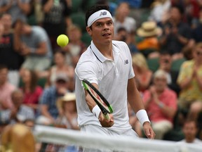 Milos Raonic celebrates his victory over Mikhail Youzhny at Wimbledon on July 6.