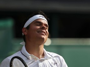 Milos Raonic reacts after a point during his match against Roger Federer at Wimbledon on July 12.