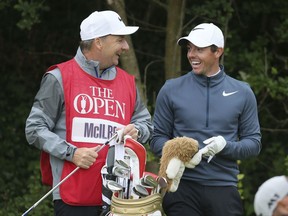 Northern Ireland's Rory McIlroy speaks with his caddie JP Fitzgerald during the second round of the British Open Golf Championship at Royal Birkdale,, Southport, Friday July 21, 2017. (Richard Sellers/PA via AP)