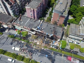 In this aerial photo released by China's Xinhua news agency shows the site of an explosion in Hangzhou, capital of east China's Zhejiang Province, Friday, July 21, 2017. A massive explosion hit a food shop in the eastern resort of Hangzhou on Friday morning. (Ke Qing/Xinhua via AP)