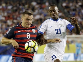 United States' Jordan Morris (8) moves the ball past Martinique's Sebastien Cretinoir (21) during a CONCACAF Gold Cup soccer match, Wednesday, July 12, 2017, in Tampa, Fla. (AP Photo/John Raoux)