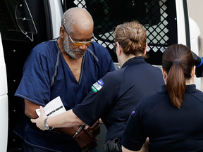 James Bradley Jr., left, arrives at a federal courthouse, July 24, 2017, in San Antonio. Bradley was arrested in connection with the deaths of multiple people packed into a broiling tractor-trailer.