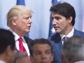 Prime Minister Justin Trudeau, right, and United States President Donald Trump chat after a Women and Development event at the G20 summit Saturday, July 8, 2017 in Hamburg, Germany.
