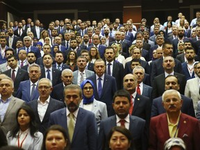 Turkey's President Recep Tayyip Erdogan, centre, attends a meeting of his ruling Justice and Development party (AKP) in Ankara, Turkey, Saturday, July 1, 2017. (Presidency Press Service via AP, Pool)