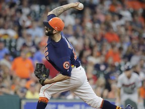 Houston Astros starting pitcher Mike Fiers throws against the Minnesota Twins during the first inning of a baseball game Sunday, July 16, 2017, in Houston. (AP Photo/David J. Phillip)