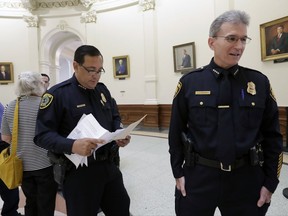 Houston Police Chief Art Acevedo, left, and San Antonio Police Chief William McManus, right, stand in the rotunda at the Texas Capitol as they wait to speak against a proposed "bathroom bill" at a public safety event, Tuesday, July 25, 2017, in Austin, Texas. The Texas Senate has revived a bill mandating transgender Texans use public restrooms corresponding to their birth-certificate genders. (AP Photo/Eric Gay)