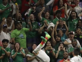 Mexico's Angel Sepulveda celebrates in front of cheering fans after he scored a goal against Curacao during a CONCACAF Gold Cup soccer match in San Antonio, Sunday, July 16, 2017. (AP Photo/Eric Gay)