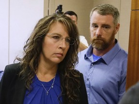 FILE - In this Tuesday, June 13, 2017 file photo, Harris County Sheriff's deputy Chauna Thompson and her husband, Terry Thompson, arrive at court in Houston. Chauna Thompson who was indicted along with her husband on murder charges in the death of a man they confronted outside a restaurant has been fired, authorities announced Friday, July 21, 2017. ( Melissa Phillip/Houston Chronicle via AP, File)