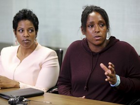 Latasha Nelson, right, speaks at a news conference with attorney Kim T. Cole, left, on Thursday, July 13, 2017, at the Next Generation Action Network in Dallas. Nelson says police in the Dallas suburb of Arlington offered to drop charges against her two teenage sons in exchange for a cellphone video she shot that allegedly shows an officer needlessly pushing her older son to the ground and arresting him. (AP Photo/Jaime Dunaway)