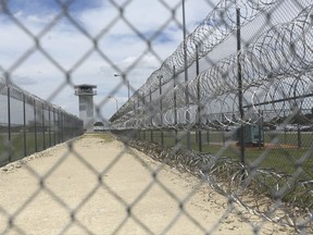 This Wednesday, June 21, 2017 photo shows barbed wire surrounding the prison that holds Jason Robinson, 39, in Gatesville, Texas. Robinson was convicted of murder at 16 and sentenced to automatic life with the possibility of parole. States are responding to U.S. Supreme Court rulings that have found mandatory life-without-parole sentences unconstitutional for juveniles except for the rare homicide offender incapable of rehabilitation. After the latest ruling in January 2016 said those serving such terms must have a chance to argue for release one day, dozens of inmates have won new sentences -- and some, freedom -- while others wait or fight to have their sentences reviewed. (AP Photo/Jaime Dunaway)