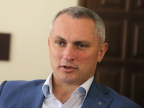 Col. Serhiy Demydiuk, the head of Ukraine's national CyberPolice unit talks during an interview with the Associated Press in his office in Kiev, Ukraine, Monday, July 3, 2017. The small Ukrainian tax software company that is accused of being the patient zero of a damaging global cyberepidemic is under investigation and will face charges, Col. Serhiy Demydiuk suggested Monday. (AP Photo/Efrem Lukatsky)