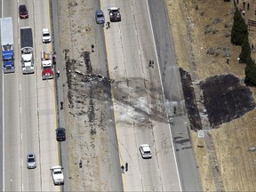 A small plane crashed after it took off from a nearby municipal airport on Interstate 15 in Riverdale, Utah, about 35 miles north of Salt Lake City, Wednesday, July 26, 2017. Authorities say several people died when the plane crashed on a northern Utah interstate median, tangling traffic and leaving blackened wreckage on the highway. (Kristin Murphy/The Deseret News via AP)