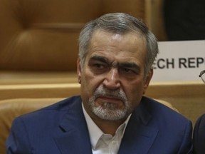 In this picture taken on Monday, July 3, 2017, Hossein Fereidoun, brother and top aide of moderate Iranian President Hassan Rouhani sits in a conference in Tehran, Iran. The semi-official Tasnim news agency reported on Sunday, July 16, that Hossein Fereidoun has been detained over financial matters. (AP Photo/Vahid Salemi)