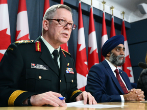 Chief of Defence Staff Gen. Jonathan Vance with Defence Minister Harjit Sajjan. Vance told defence officials he wants the tax issue resolved by mid-August.