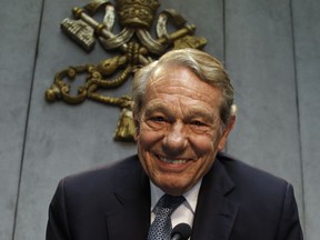 FILE -- In this photo taken on April 25, 2014, former Pope John Paul II spokesperson Joaquin Navarro-Valls smiles prior to the start of a press conference at the Vatican. Joaquin Navarro-Valls, a suave, silver-haired Spaniard who was a close confidant of Pope John Paul II, serving for more than two decades as chief Vatican spokesman, has died at the age of 80, Wednesday, July 5, 2017.  (AP Photo/Gregorio Borgia)