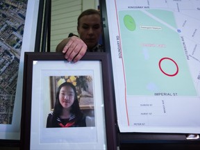 RCMP Cpl. Daniela Panesar places a photo of Marissa Shen, 13, next to a map indicating where her body was found in Central Park, during a news conference in Burnaby, B.C., on Wednesday July 19, 2017. Police say they are investigating a potential homicide after Shen's body was found in a popular park in Burnaby after her family contacted RCMP late Tuesday night, reporting the teen missing. THE CANADIAN PRESS/Darryl Dyck