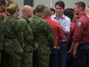 Prime Minister Justin Trudeau meets firefighters, members of the Canadian Forces and RCMP officers in Williams Lake, B.C., on Monday July 31, 2017. THE CANADIAN PRESS/Darryl Dyck
