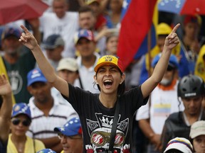 Anti-government demonstrators protest in Caracas, Venezuela, Saturday, July 1, 2017. Demonstrators are taking the the streets after three months of continued protests that has left dozens dead and seen the country's chief prosecutor Luisa Ortega barred from leaving the country and her bank accounts frozen, by the Supreme Court following her mounting criticisms of President Nicolas Maduro. (AP Photo/Ariana Cubillos)