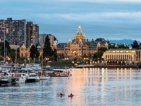 The B.C. Parliament Buildings, lit up at night, overlooking Victorias Inner Harbour. Photo credit: Photo courtesy of Destination British Columbia. For Joanne Sasvari feature slugged 0624 canada 150 destinations. [PNG Merlin Archive]