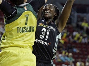 Seattle Storm's Ramu Tokashiki (7) tries to block a shot by New York Liberty's Tina Charles during the first half of a WNBA basketball game Thursday, July 6, 2017, in Seattle. (AP Photo/Elaine Thompson)