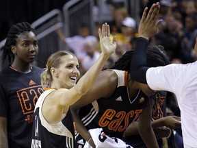 Eastern Conference's Allie Quigley, of the Chicago Sky, is congratulated by teammates after winning the 3-point contest at the WNBA All-Star basketball game Saturday, July 22, 2017, in Seattle. (AP Photo/Elaine Thompson)