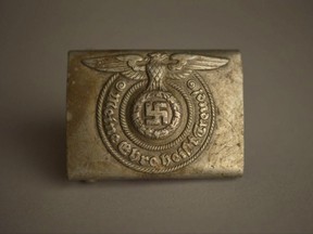 An SS belt buckle from an Aushwitz Museum exhibition. Officials at the museum of the Nazi German death camp of Auschwitz say some exhibits are going on a tour of Europe and North America to bring its tragic truth about the Holocaust to a wider audience.
