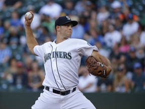 Seattle Mariners starting pitcher Sam Gaviglio throws to an Oakland Athletics batter during the first inning of a baseball game, Thursday, July 6, 2017, in Seattle. (AP Photo/Ted S. Warren)