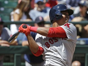 Boston Red Sox's Rafael Devers follows through after hitting a solo home run, his first major-league hit, in the third inning of a baseball game against the Seattle Mariners, Wednesday, July 26, 2017, in Seattle. (AP Photo/Ted S. Warren)