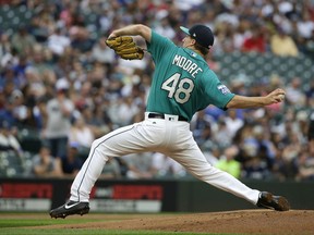 Seattle Mariners starting pitcher Andrew Moore throws against the New York Yankees during the first inning of a baseball game, Friday, July 21, 2017, in Seattle. (AP Photo/Ted S. Warren)
