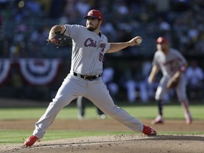 Chicago White Sox pitcher Carlos Rodon works against the Oakland Athletics in the first inning of a baseball game Monday, July 3, 2017, in Oakland, Calif. (AP Photo/Ben Margot)