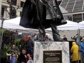 A statue of William Seward is unveiled in a plaza across from the Alaska state Capitol on Monday, July 3, 2017, in Juneau, Alaska. The statue commemorates the 150th anniversary of the agreement under which the U.S. bought the territory of Alaska from Russia. As Secretary of State in 1867, Seward signed and helped negotiate the Treaty of Cession with Russia. (AP Photo/Becky Bohrer)