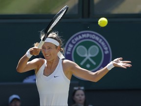 Victoria Azarenka of Belarus returns to Britain's Heather Watson during their Women's Singles Match on day five at the Wimbledon Tennis Championships in London Friday, July 7, 2017. (AP Photo/Alastair Grant)