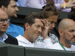 Former tennis player Jonas Bjorkman of Sweden watches the Men's Singles semifinal match between Sam Querrey of the United States and Croatia's Marin Cilic on day eleven at the Wimbledon Tennis Championships in London, Friday, July 14, 2017. (AP Photo/Alastair Grant)