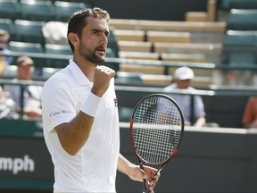 Croatia's Marin Cilic celebrates after winning the Men's Singles Match against Steve Johnson of the United States on day five at the Wimbledon Tennis Championships in London Friday, July 7, 2017. (AP Photo/Kirsty Wigglesworth)