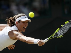 Britain's Johanna Konta returns to Greece's Maria Sakkari during their Men's Singles Match on day five at the Wimbledon Tennis Championships in London Friday, July 7, 2017. (AP Photo/Kirsty Wigglesworth)