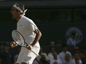 Switzerland's Roger Federer celebrates after beating Canada's Milos Raonic at the end of their Men's Singles Quarterfinal Match on day nine at the Wimbledon Tennis Championships in London Wednesday, July 12, 2017. (AP Photo/Tim Ireland)