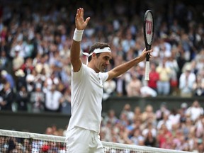 Switzerland's Roger Federer celebrates after beating Czech Republic's Tomas Berdych in their Men's Singles semifinal match on day eleven at the Wimbledon Tennis Championships in London, Friday, July 14, 2017. (Gareth Fuller/Pool Photo via AP)