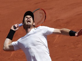 FILE - In this June 9, 2017, file photo, Britain's Andy Murray serves against Switzerland's Stan Wawrinka during their semifinal match of the French Open tennis tournament at Roland Garros stadium, in Paris. Murray's comfort level and crowd support at Wimbledon are both so strong that he can't be ruled out as a serious title contender. Play begins on Monday, July 3. (AP Photo/Christophe Ena, File)